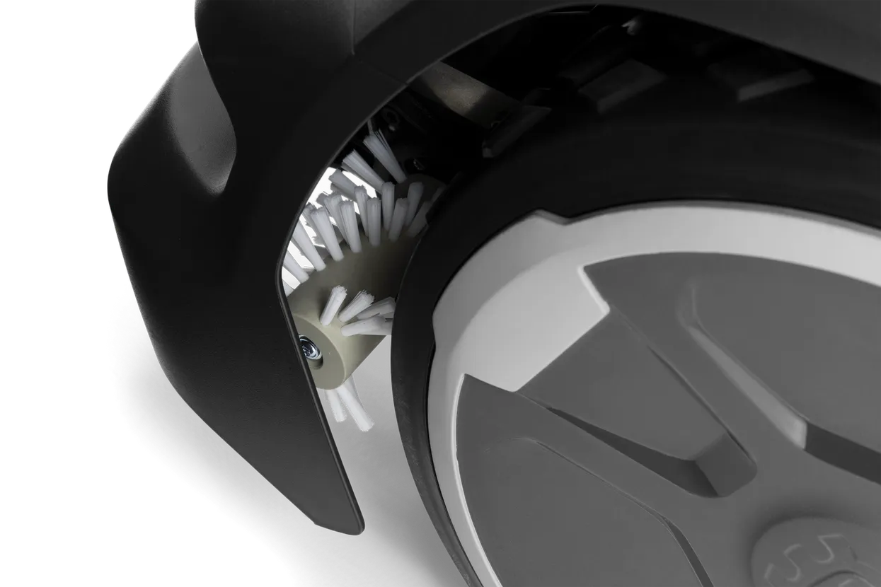 Efficient motorized wheel brushes that keep the drive wheels clean from wet clippings, dirt and autumn leaves.